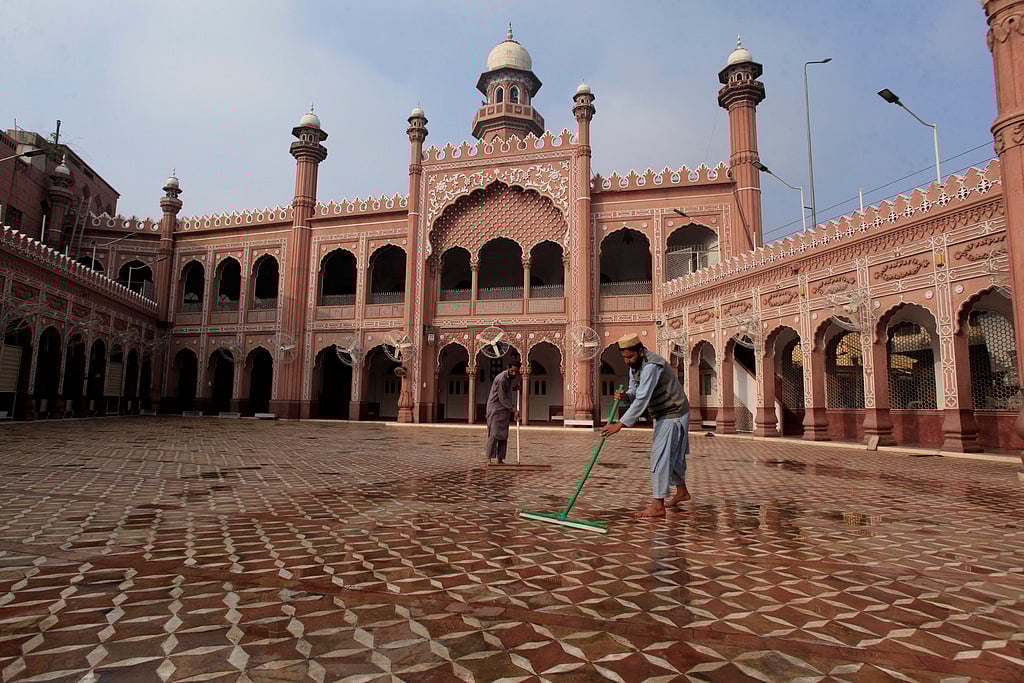 Workers clean a historical Sunehri mosque in preparation for the upcoming Muslim fasting month of Ramadan, in Peshawar, Pakistan, Friday, Feb. 28, 2025.  - AP