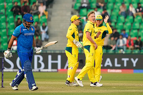 ICC Champions Trophy, AFG vs AUS: Afghanistan's Gulbadin Naib, left, walks off the field