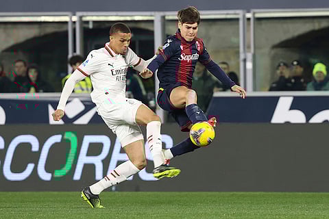 Serie A 2024-25: Bologna's Benjamin Dominguez and Milan's Malick Thiaw in action