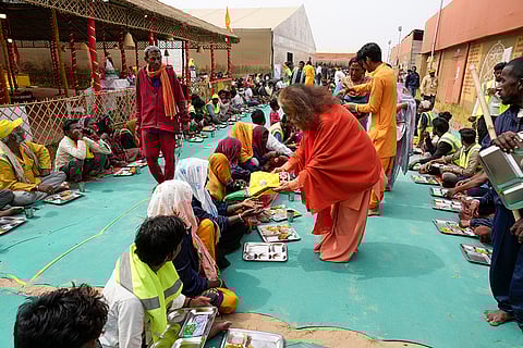 Maha Kumbh 2025: Swami Chidanand Saraswati distributes saree to sanitation workers