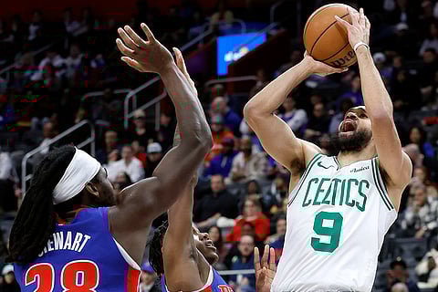 NBA 2024-25: Celtics guard Derrick White (9) takes a shot
