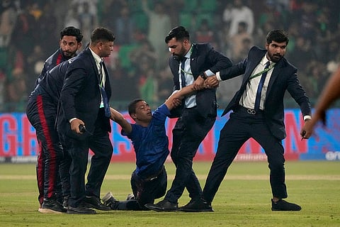 CT 2025, AFG vs ENG: Security officers carry a pitch invader