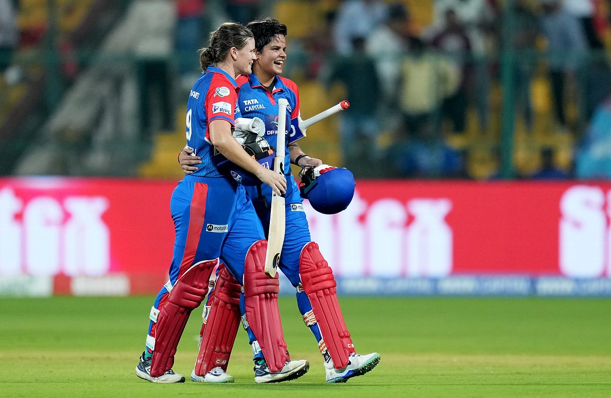 (PTI Photo/Shailendra Bhojak) : Bengaluru: Delhi Capitals' batters Jess Jonassen and Shafali Verma celebrate after winning the Women's Premier League (WPL) 2025 cricket match against Royal Challengers Bengaluru, at M Chinnaswamy Stadium, in Bengaluru, Karnataka, Saturday, March 1, 2025. 