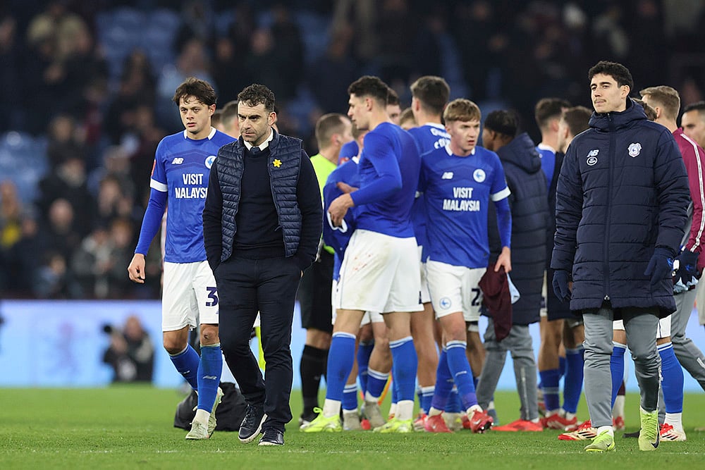 | Photo: AP/Darren Staples : English FA Cup fifth round: Cardiff City's head coach Omer Riza walks with his team