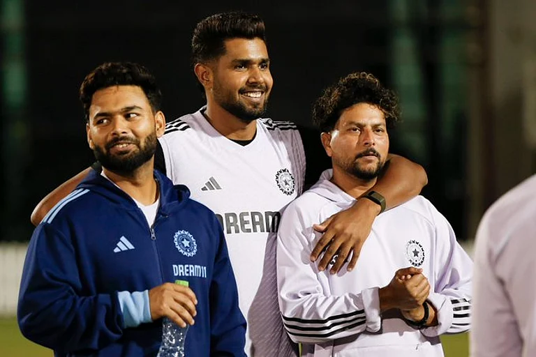Rishabh Pant with Harshit Rana (C) and Kuldeep Yadav (R) - X/BCCI