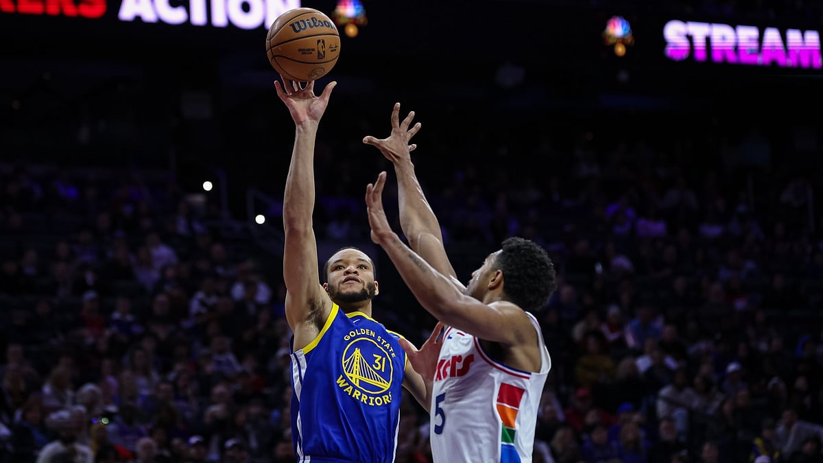 Kevin Knox II #31 of the Golden State Warriors shoots the ball over Quentin Grimes #5 of the Philadelphia 76ers during the first half of the game at the Wells Fargo Center on March 1, 2025 in Philadelphia, Pennsylvania.