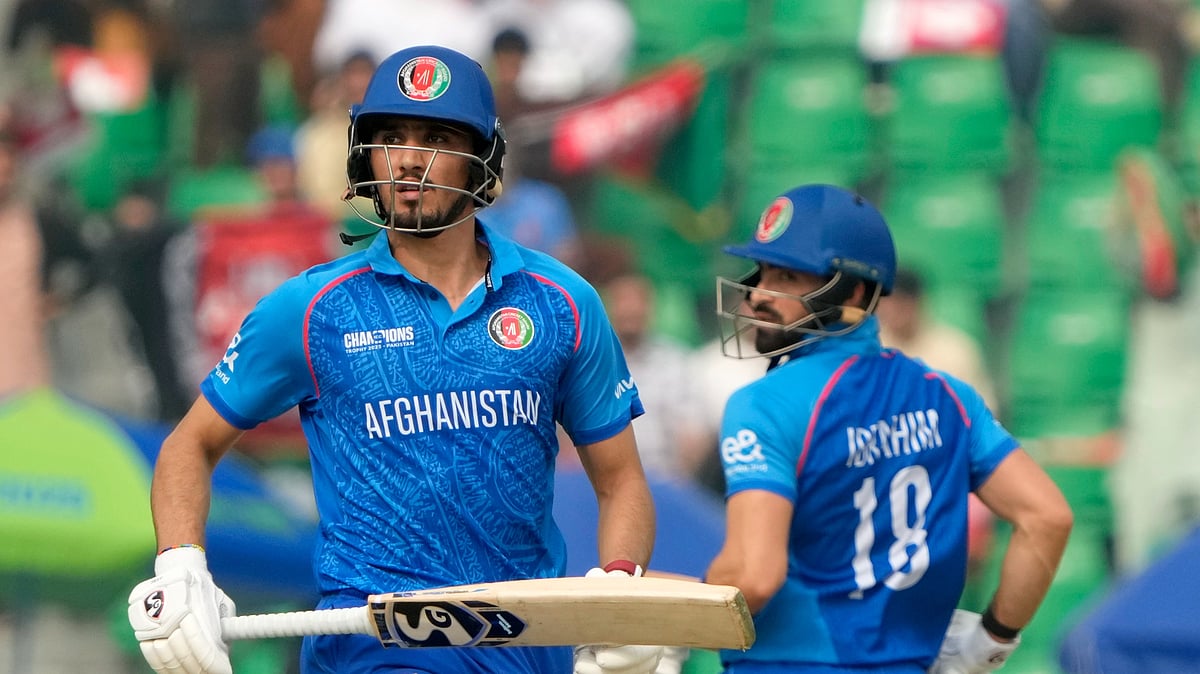 AP Photo/K.M. Chaudary : Afghanistan's Sediqullah Atal, left, and Ibrahim Zadran run between the wickets for score during the ICC Champions Trophy cricket match between Australia and Afghanistan, in Lahore.