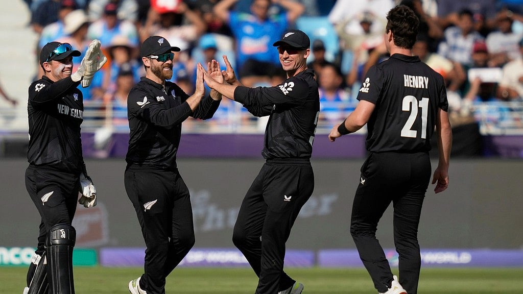 AP : New Zealand's Kane Williamson, second left, celebrates with teammates after taking the catch to dismiss India's Ravindra Jadeja during the ICC Champions Trophy.
