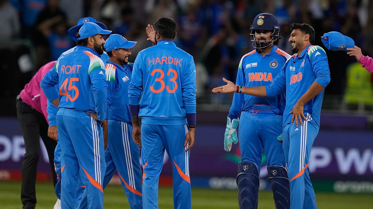 AP Photo/Altaf Qadri : India's Axar Patel celebrates the wicket of New Zealand's Kane Williamson with his team mates during the ICC Champions Trophy cricket match between India and New Zealand at Dubai International Cricket Stadium in Dubai.