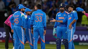 AP Photo/Altaf Qadri : India's Axar Patel celebrates the wicket of New Zealand's Kane Williamson with his team mates during the ICC Champions Trophy cricket match between India and New Zealand at Dubai International Cricket Stadium in Dubai.