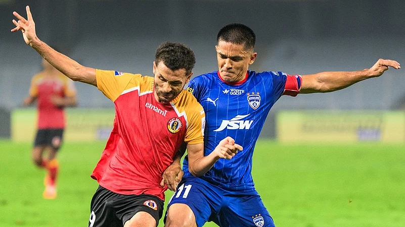 Sunil Chhetri (right) vies for the ball with Mahesh Naorem