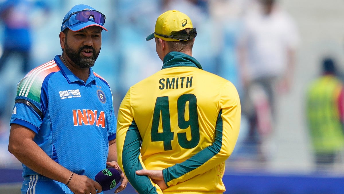 Altaf Qadri/AP : India's captain Rohit Sharma, left, speaks to Australia's captain Steve Smith at the toss ahead of the ICC Champions Trophy semifinal cricket match between India and Australia