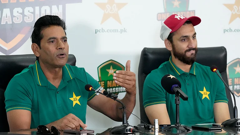 Pakistan interim head coach Aaqib Javed, left, speaks as Salman Ali Agha watches during a press conference to announce squad for upcoming New Zealand tour, in Lahore. - AP Photo/K.M Chaudary