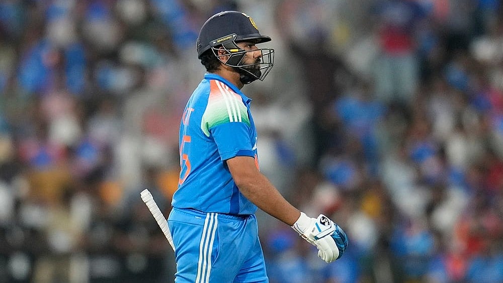 | Photo: AP/Aijaz Rahi : India's captain Rohit Sharma walks off the field.