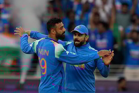Kohli’s 300th ODI, IND vs NZ: Varun Chakravarthy celebrate the wicket of New Zealand's Will Young with India's Virat Kohli