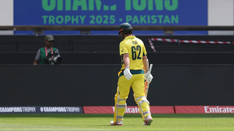 Australias Travis Head walks off the field after losing his wicket. AP