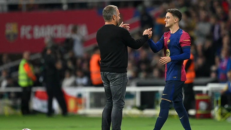 Hansi Flick and Gavi - null