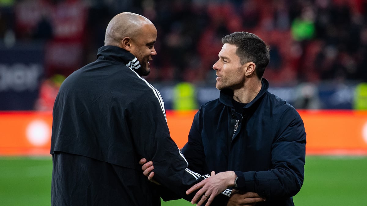 Vincent Kompany and Xabi Alonso share a handshake