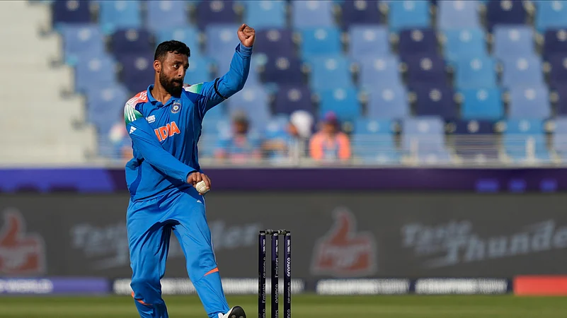 Indias Varun Chakravarthy bowls a delivery. AP Photo