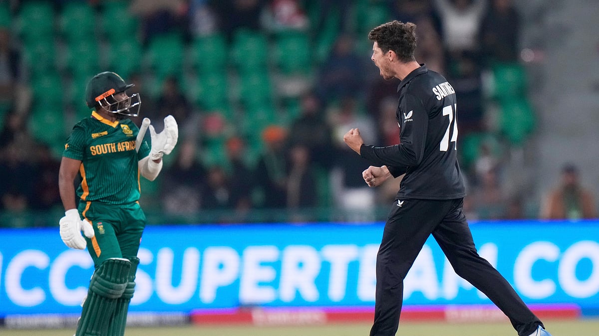 AP Photo/Anjum Naveed : New Zealand's captain Mitchel Santner, right, celebrates the dismissal of South Africa's captain Temba Bavuma, left, during the ICC Champions Trophy semifinal cricket match between New Zealand and South Africa at Gaddafi Stadium in Lahore.