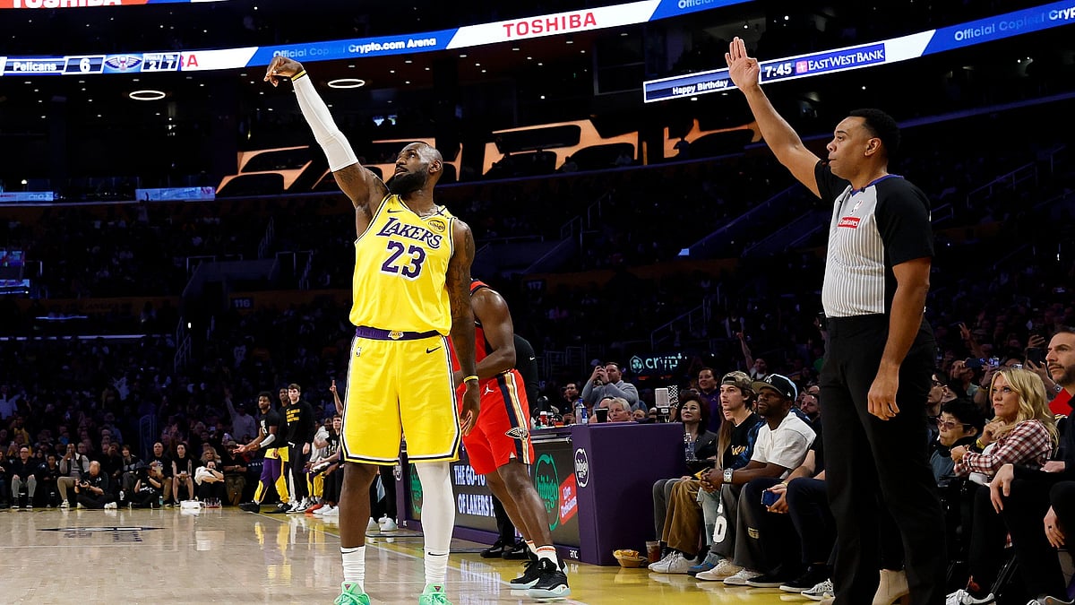 LeBron James #23 of the Los Angeles Lakers reacts to his 3-point basket to score his 50,002 NBA regular season and playoff career points during the first half against the New Orleans Pelicans at Crypto.com Arena on March 04, 2025 in Los Angeles, California.
