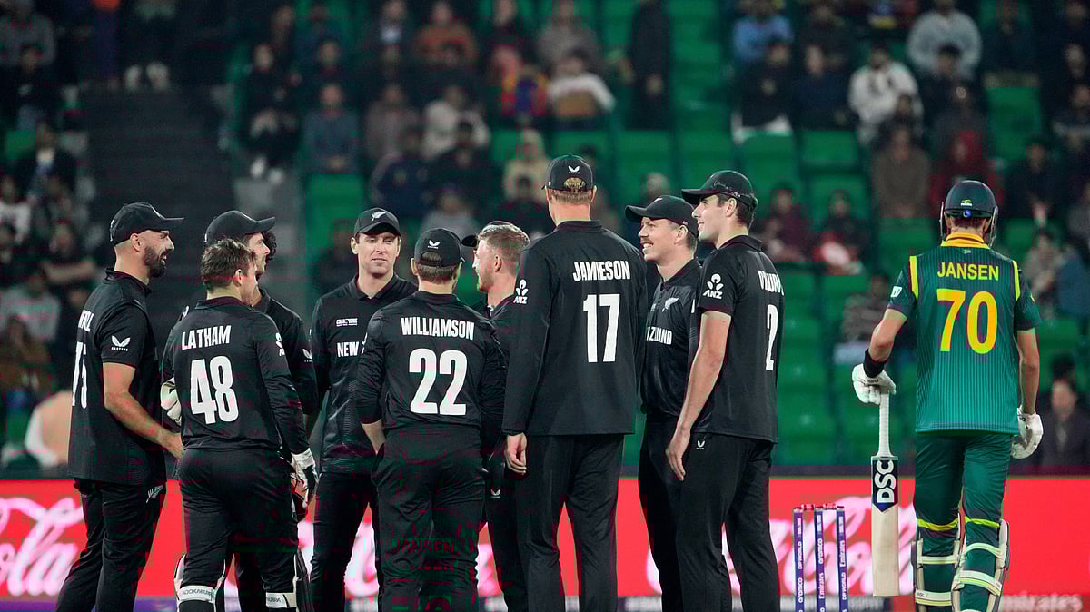 AP Photo/K.M Chaudary : New Zealand's players celebrate the dismissal South Africa's Marco Jansen, right, of during the ICC Champions Trophy semifinal cricket match between New Zealand and South Africa at Gaddafi Stadium in Lahore.