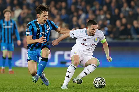 UCL 2024-25 Round Of 16 First leg, Brugge vs Villa: Ardon Jashari, left, fights for the ball with John McGinn
