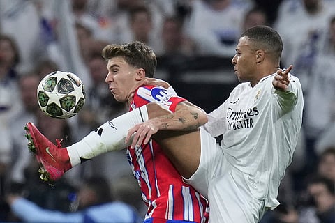 UCL 2024-25 Round Of 16 First leg, RMA vs ATM:  Pablo Barrios, left, fights for the ball with Kylian Mbappe