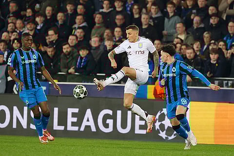 UCL 2024-25 Round Of 16 First leg, Brugge vs Villa: Lucas Digne, center, fights for the ball with Joel Ordonez, left, and Chemsdine Talbi