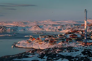 The village of Ilulissat, with a population of approximately 4000, sits among glaciers and snow-covered hills on March 03, 2025.