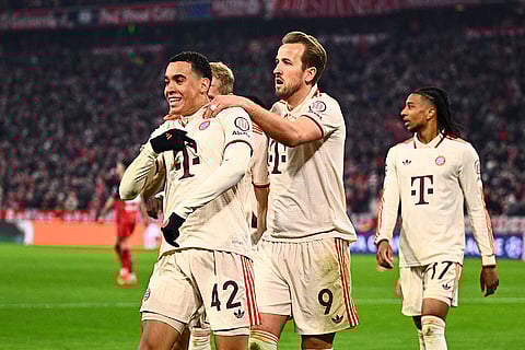 UCL round of 16 first leg, FCB vs Bayer 04: Munich's Jamal Musiala celebrates with Harry Kane after scoring his side's second goal
