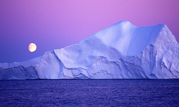 Moon over an iceberg