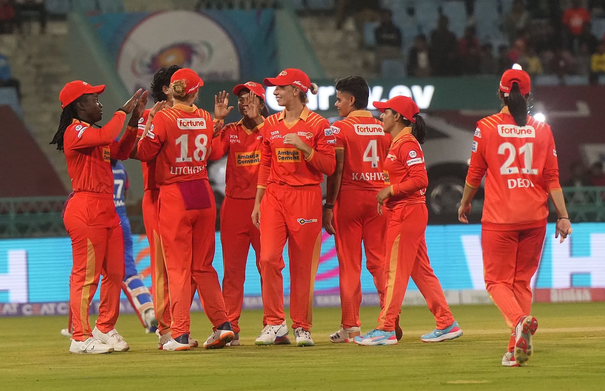 (PTI Photo/Nand Kumar)

 : Lucknow: Gujarat Giants players celebrate a wicket during the Women's Premier League (WPL) 2025 cricket match between Delhi Capitals and Gujarat Giants, at Ekana Cricket Stadium, in Lucknow, Friday, March 7, 2025. 