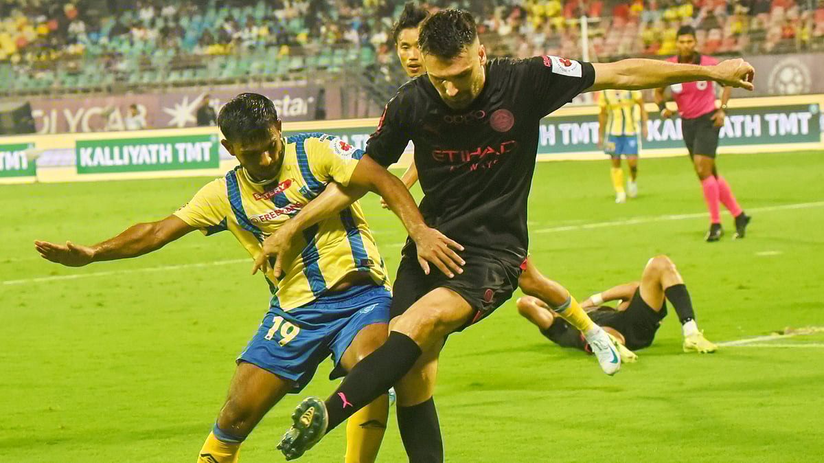 PTI : Mohammed Aimen, left, of Kerala Blasters FC and Jon Toral of Mumbai City FC vie for the ball during their Indian Super League match.