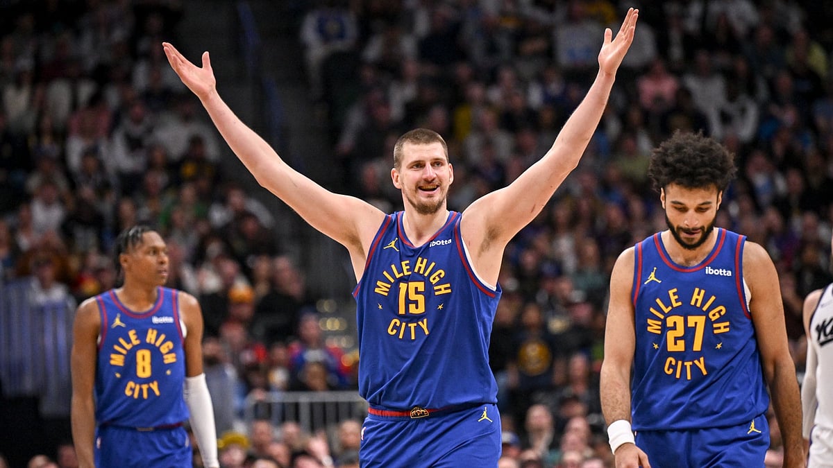 Jamal Murray (27), Peyton Watson (8) and Nikola Jokic (15) of the Denver Nuggets react after Jokic was called for a defensive foul during the fourth quarter of the Nuggets' 116-110 win over the Sacramento Kings at Ball Arena in Denver, Colorado on Wednesday, March 5, 2025