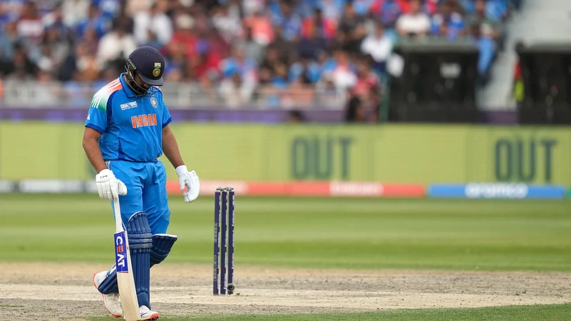 Indias captain Rohit Sharma walks off the field. AP Photo
