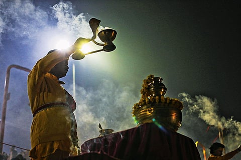 Evening aarti on the bank of Saryu River in the temple town