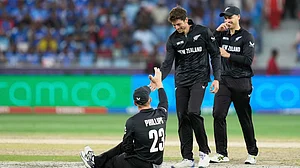 AP/Altaf Qadri : New Zealand's Glenn Phillips, left, is congratulated by New Zealand's captain Mitchel Santner, center, after taking the catch to get India's Shubman Gill out during the ICC Champions Trophy final cricket match between India and New Zealand at Dubai International Cricket Stadium in Dubai, United Arab Emirates, Sunday, March 9, 2025.