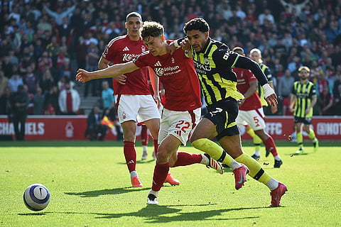 EPL 2024-25, Forest Vs Man City: Nottingham Forest's Ryan Yates, left, and Manchester City's Omar Marmoush vie for the ball