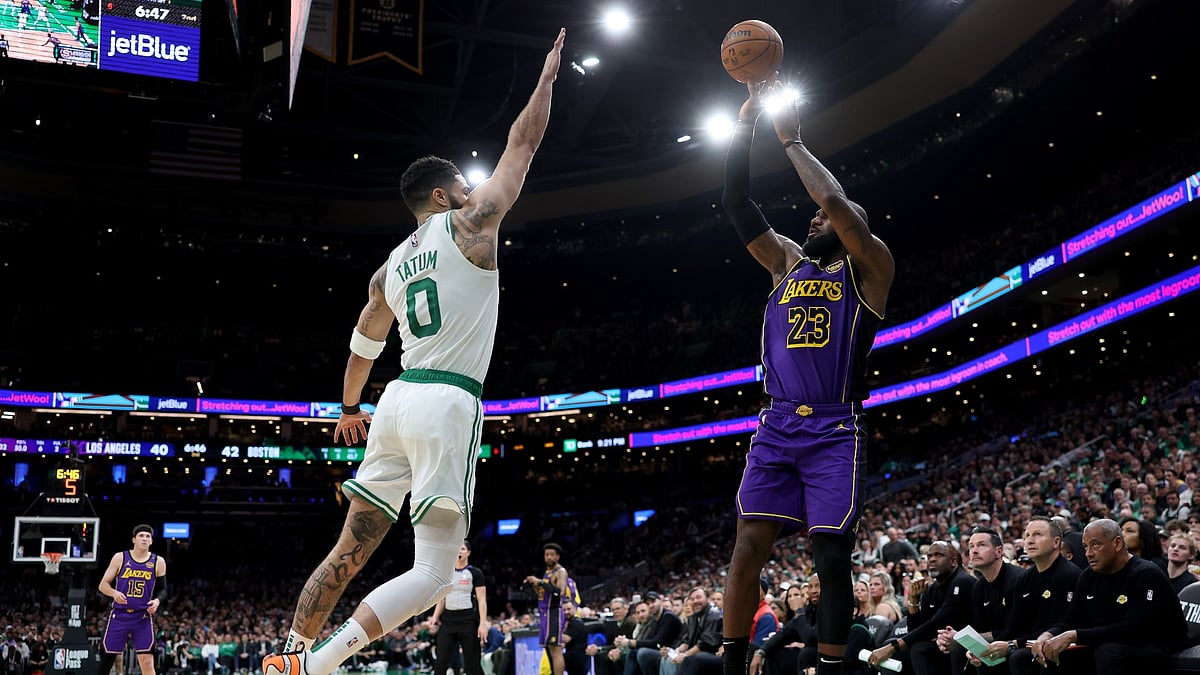 LeBron James #23 of the Los Angeles Lakers takes a shot as Jayson Tatum #0 of the Boston Celtics defends during the first half at TD Garden on March 08, 2025 in Boston, Massachusetts