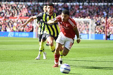 EPL 2024-25, Forest Vs Man City: Nottingham Forest's Morgan Gibbs-White, front, and Manchester City's Matheus Nunes go for the ball