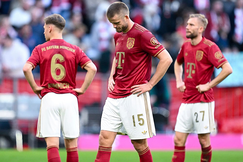 | Photo: Sven Hoppe/dpa via AP : Bundesliga, Bayern Munich and VfL Bochum: Bayern's Joshua Kimmich, Eric Dier and Konrad Laimer lok dejected after the match
