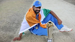 AP : India captain Rohit Sharma poses with the winners trophy after defeating New Zealand in the final of the ICC Champions Trophy.