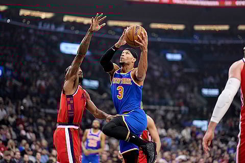 NBA 2024-25: New York Knicks guard Josh Hart, right, shoots