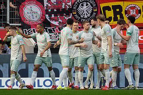 Bundesliga, Leverkusen and Werder Bremen: Bremen's Romano Schmid celebrates with his team after scoring the opening goal