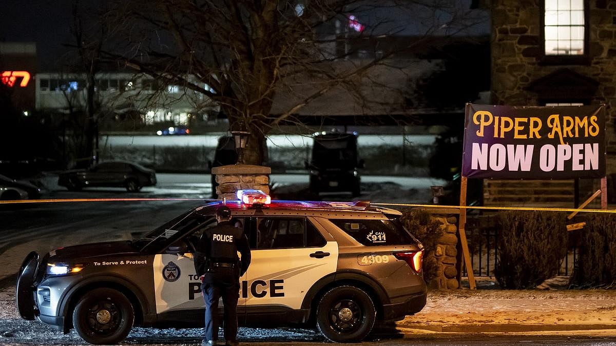 | Photo Credit: AP : Toronto Police investigate a shooting at the Piper Arms Pub near the Scarborough Town Centre in Toronto on Saturday, March 8, 2025.