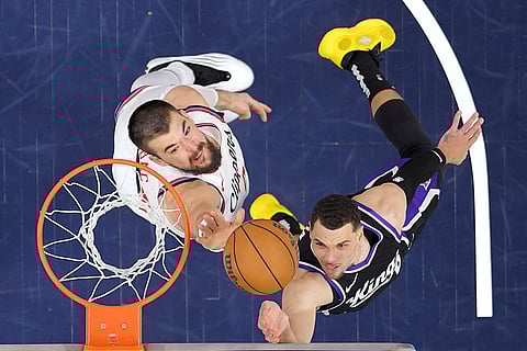 Kings vs Clippers NBA Basketball: Sacramento Kings guard Zach LaVine, right, shoots