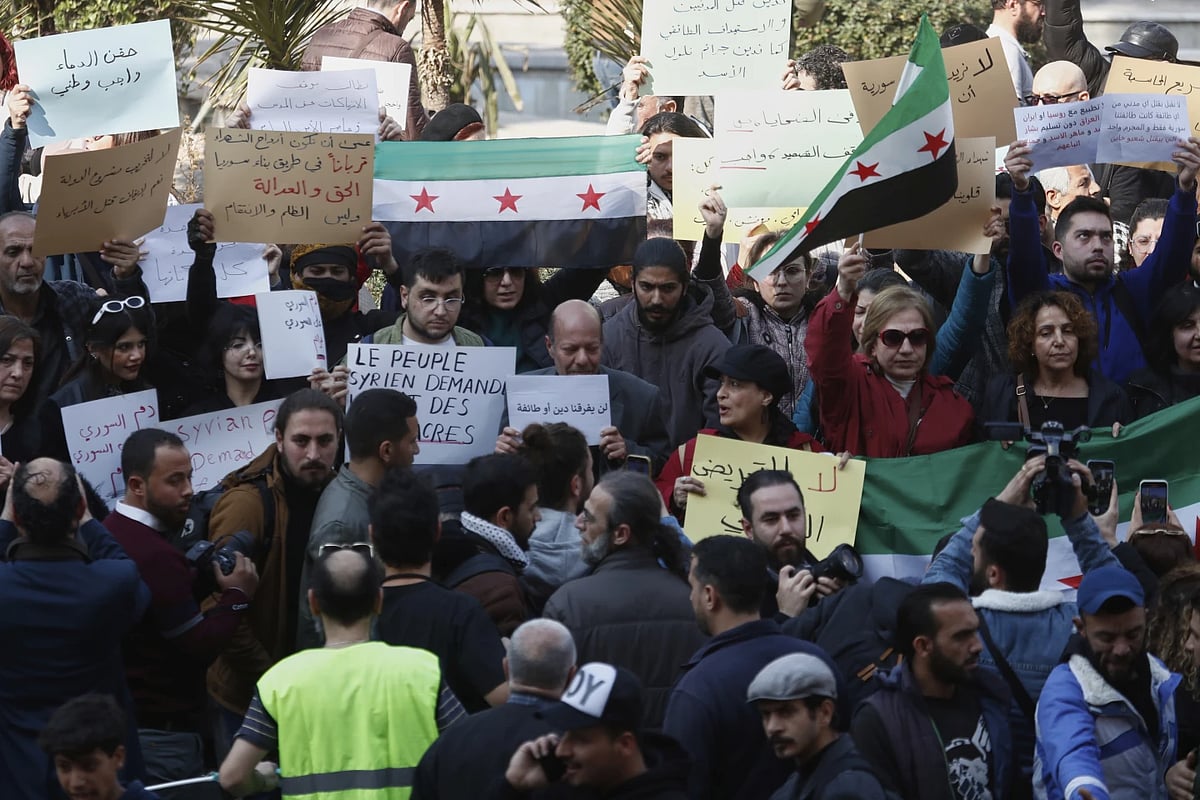 AP : Activists protest against violence and sectarian attacks in syria on March 9, 2025 |
