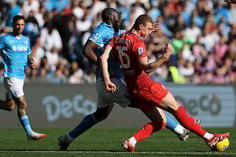 Napoli's Romelu Lukaku and Fiorentina's Pietro Comuzzo in action