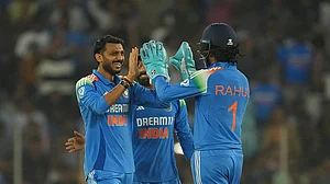 | Photo: AP/Ajit Solanki : Axar Patel celebrates with KL Rahul
